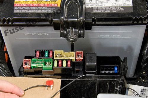 The location of the fuses in the engine compartment: Nissan Leaf (2010-2017)